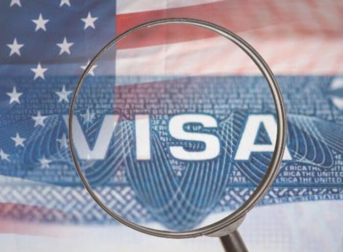 USA Travel Insurance From India: Coverage, Documents & Costs 3 Indian traveller checking travel insurance before a USA trip