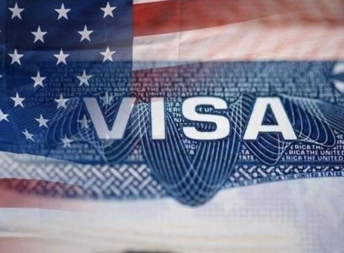 USA Travel Insurance From India: Coverage, Documents & Costs 2 Indian traveller checking travel insurance before a USA trip