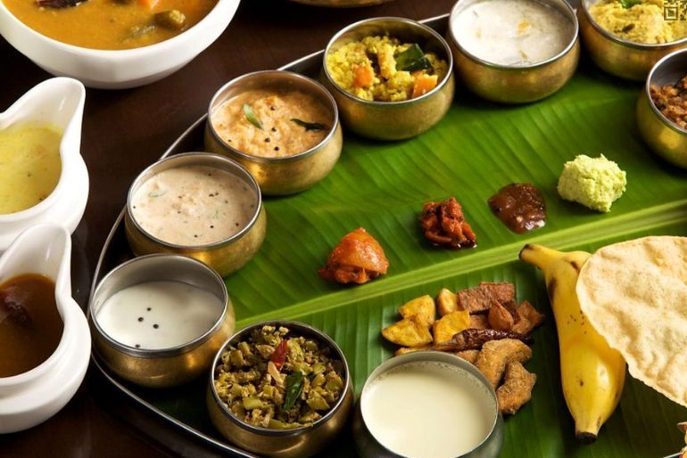 Onam Sadya dishes served on a banana leaf