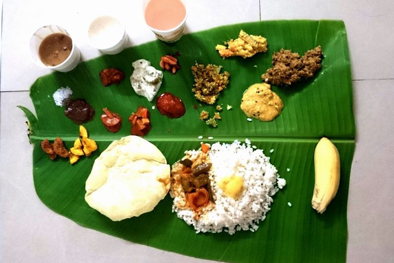 Onam Sadya dishes served on a banana leaf