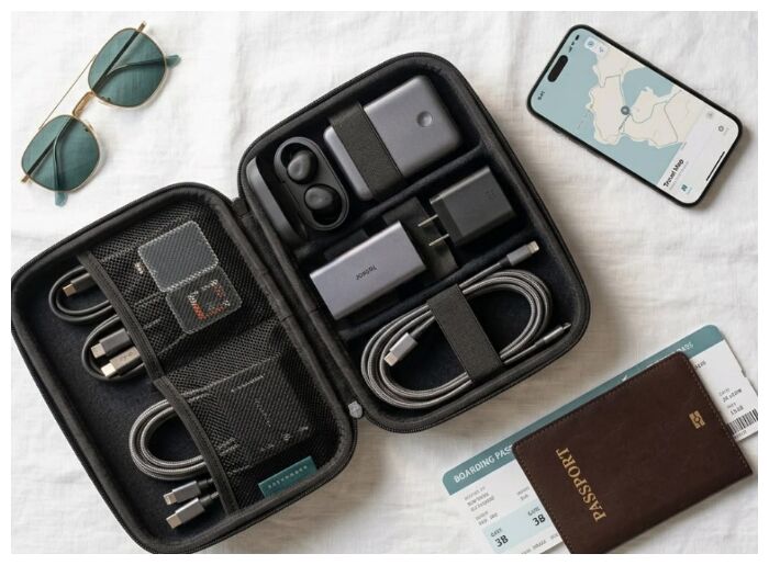 Organised suitcase with travel essentials and packing items
