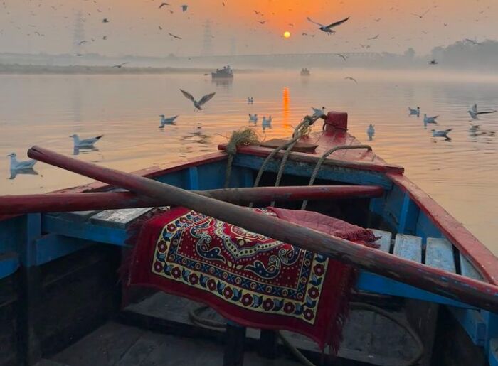 Travelers exploring the historic ghats of Varanasi along the Ganges during a three-day Varanasi itinerary