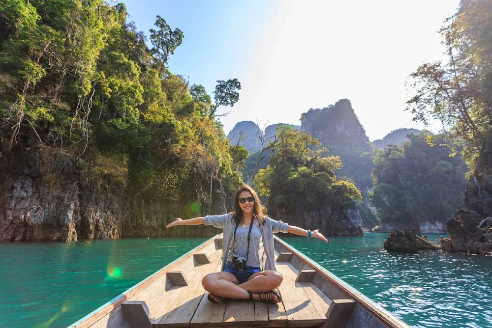how to travel the world for free and get paid