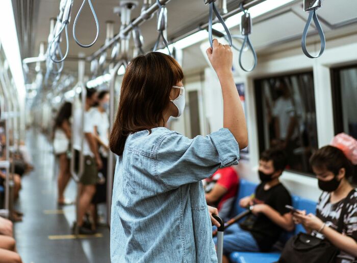 A woman traveling in a metro train