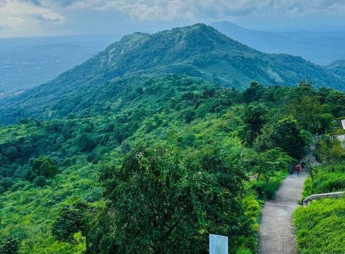 Scenic tourist attractions and places to visit in Malappuram, Kerala, including green hills, waterfalls, and historic landmarks.