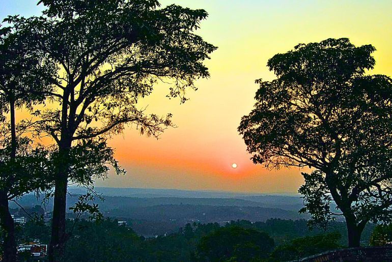 Scenic tourist attractions and places to visit in Malappuram, Kerala, including green hills, waterfalls, and historic landmarks.