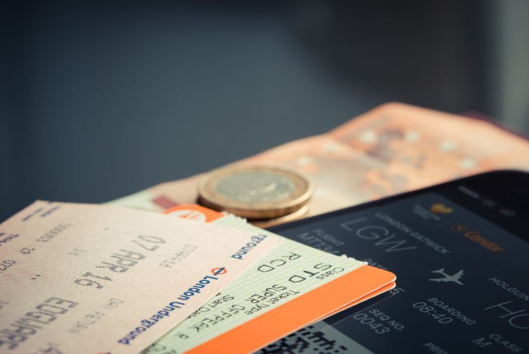 Can You Book Flights Before Your Visa Is Approved? What To Make Refundable And What To Check 1 Traveler checking flight details before receiving a visa decision