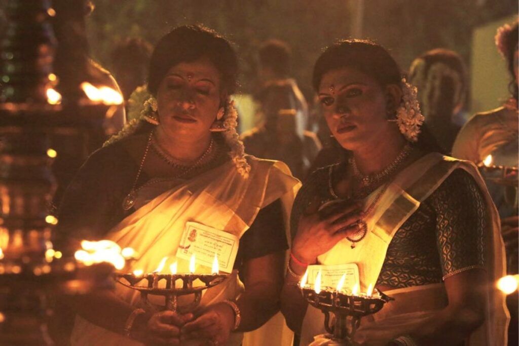 Why Do Men Dress In Sarees And Wear Makeup At This Kerala Temple? The Unique Ritual Explained 1 Chamayavilakku festival: men wearing sarees in Kerala temple