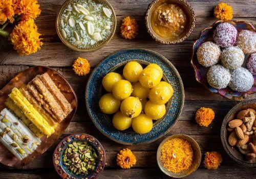 Traditional Punjabi sweets including Pinni, Panjiri, Phirni, and Dodha Barfi